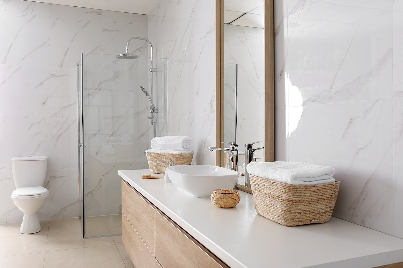 Herringbone tile floor and glass shower