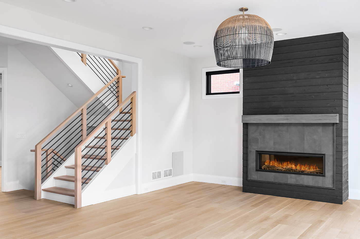 Updated stair with wood treads and black railing