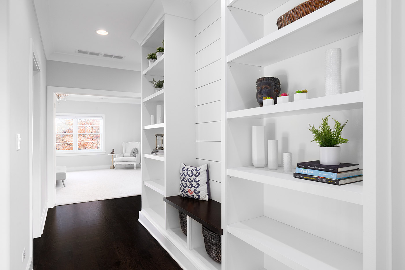 Primary suite with accent wall and natural light